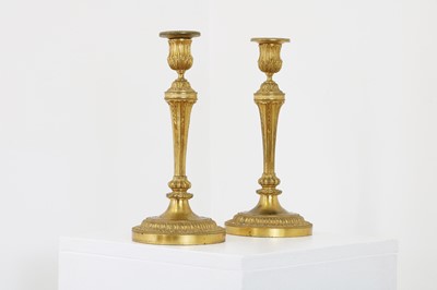 Lot 150 - A pair of Louis XVI-style gilt-bronze candlesticks