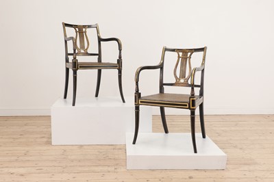 Lot 73 - A pair of Regency ebonised and parcel-gilt armchairs