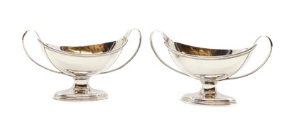 Lot 36 - A pair of George III silver twin handled salts