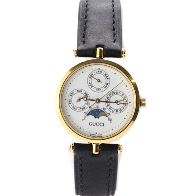 Lot 1433 - A gold plated Gucci quartz strap watch