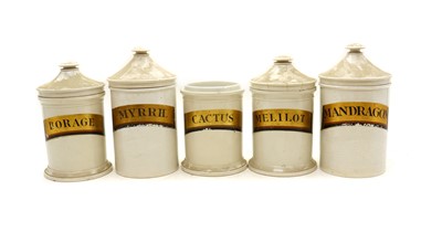 Lot 261 - A series of five earthenware drug jars with conical covers