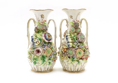 Lot 246 - A pair of twin handled porcelain vases