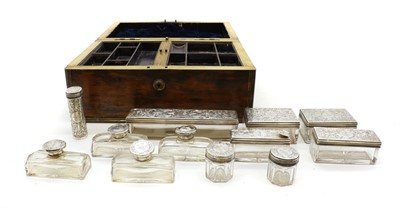 Lot 59 - A cased silver topped dressing table set