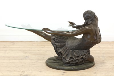 Lot 504 - A patinated bronzed resin ballerina coffee table