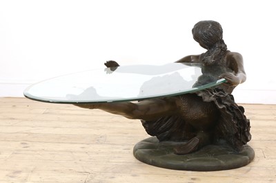 Lot 504 - A patinated bronzed resin ballerina coffee table