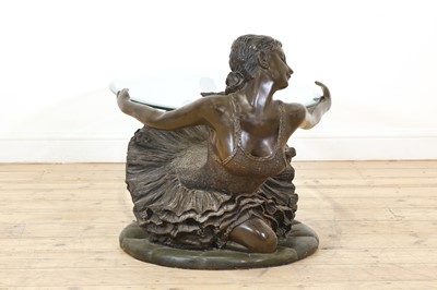 Lot 504 - A patinated bronzed resin ballerina coffee table