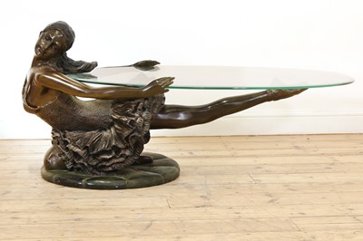 Lot 504 - A patinated bronzed resin ballerina coffee table