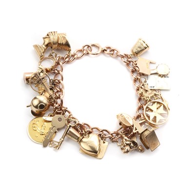 Lot 1505 - A gold charm bracelet