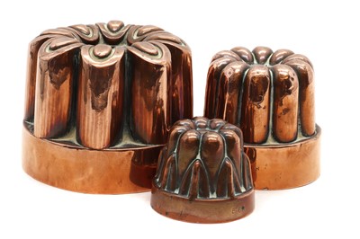 Lot 366 - A graduated set of three copper jelly moulds