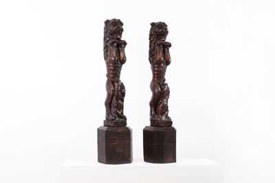 Lot 298 - A pair of large carved walnut pilasters or terms