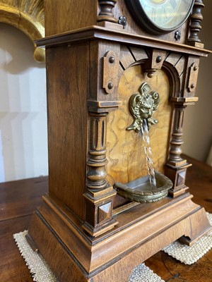 Lot 434 - An oak waterfall clock