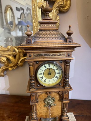 Lot 434 - An oak waterfall clock