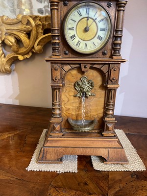 Lot 434 - An oak waterfall clock