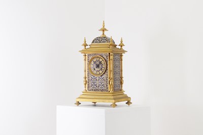 Lot 136 - A late Victorian brass and enamel mantel clock