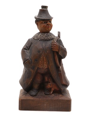 Lot 414 - A Black Forest carved softwood 'whistling figure'