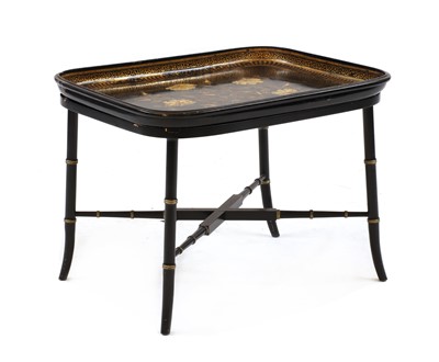 Lot 549 - A Regency design black lacquer and gilt tray top low table