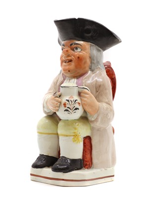 Lot 237 - A Staffordshire pottery warty faced Toby jug