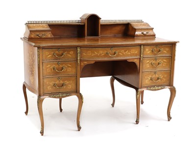 Lot 539 - A Louis XV style kingwood desk