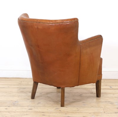 Lot 158 - A tan leather armchair