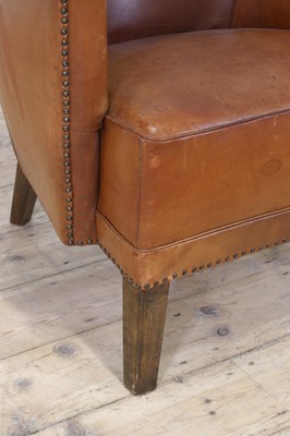 Lot 158 - A tan leather armchair