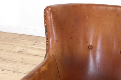 Lot 158 - A tan leather armchair