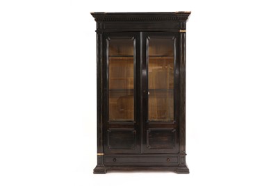 Lot 635 - An ebonised and glazed wall cabinet
