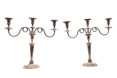 Lot 114 - A pair of George V silver plated candelabra