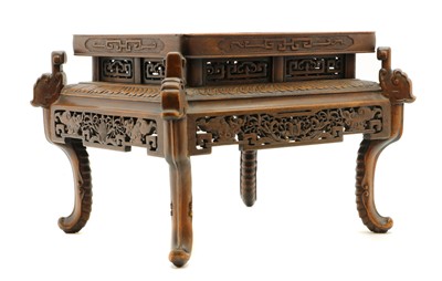 Lot 312 - A Chinese hardwood jardiniere stand