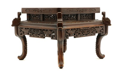 Lot 312 - A Chinese hardwood jardiniere stand