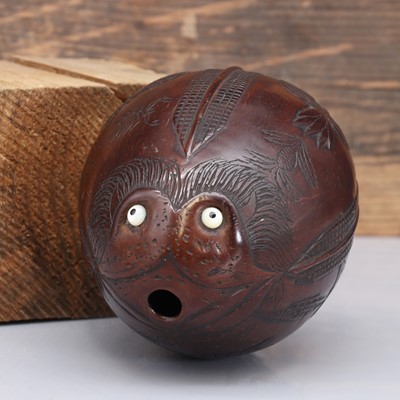 Lot 491 - A carved 'bugbear' coconut flask
