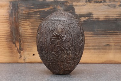 Lot 200 - A carved 'bugbear' coconut flask