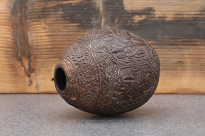 Lot 200 - A carved 'bugbear' coconut flask