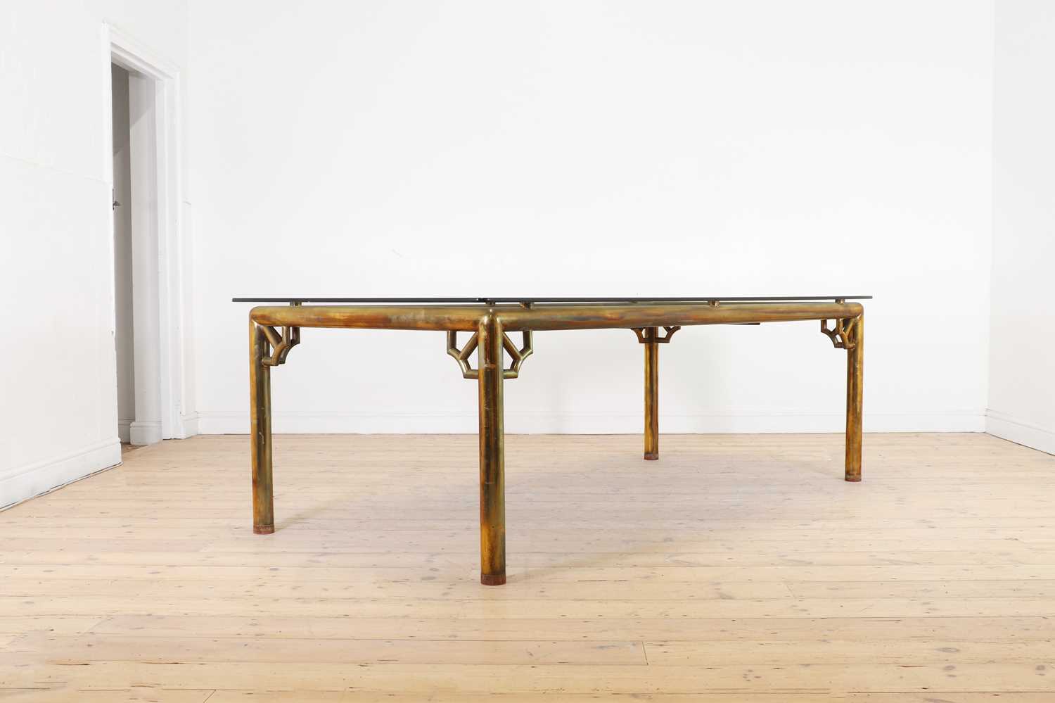 Lot 192 - A chinoiserie brass dining table