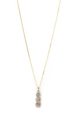 Lot 1136 - A 9ct gold diamond triple cluster pendant