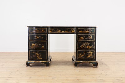 Lot 260 - A George II-style black-lacquered twin pedestal desk