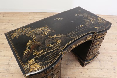 Lot 260 - A George II-style black-lacquered twin pedestal desk