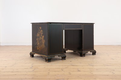 Lot 260 - A George II-style black-lacquered twin pedestal desk