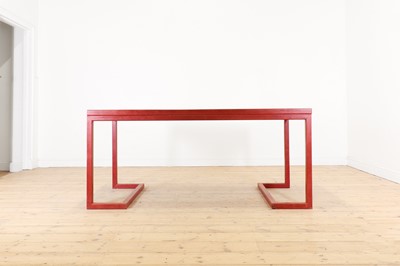 Lot 278 - A modernist red leather desk