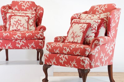 Lot 252 - A pair of George II-style wingback armchairs