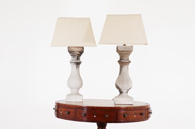 Lot 282 - A pair of composition stone baluster table lamps