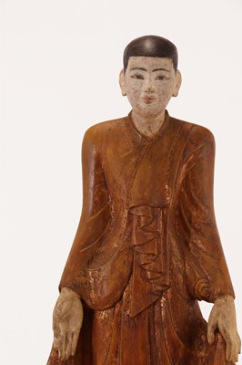 Lot 286 - A gilt and painted wooden standing Buddha