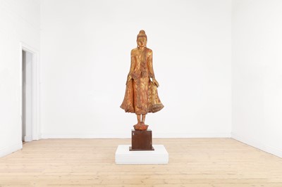 Lot 242 - A lacquered and giltwood standing Buddha