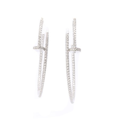 Lot 1182 - A pair of Cartier 'Juste un Clou' diamond set hoop earrings