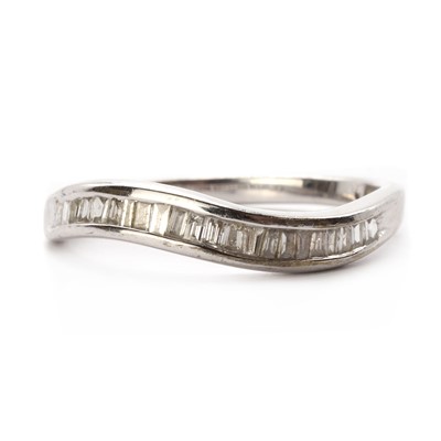 Lot 1169 - A 9ct white gold diamond half eternity ring