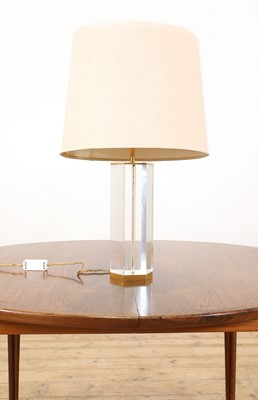 Lot 514 - A Lucite and brass table lamp