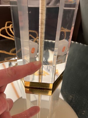 Lot 514 - A Lucite and brass table lamp