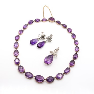 Lot 72 - A cased Victorian amethyst rivière necklace, pendant and earrings suite
