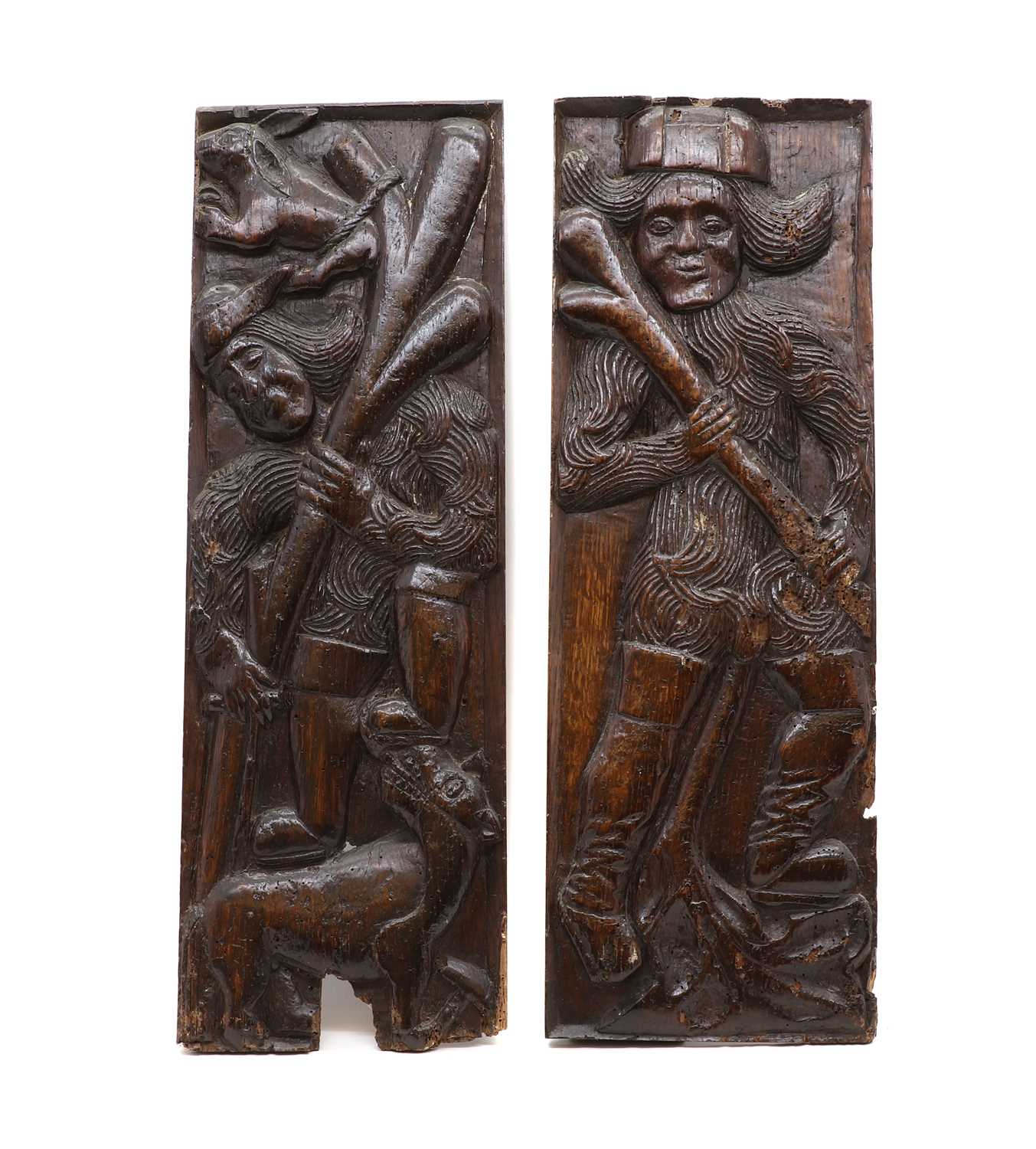Lot 516 - A pair of carved oak Romayne panels