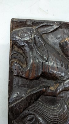 Lot 516 - A pair of carved oak Romayne panels