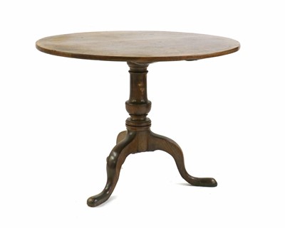 Lot 457 - A George III oak tripod table